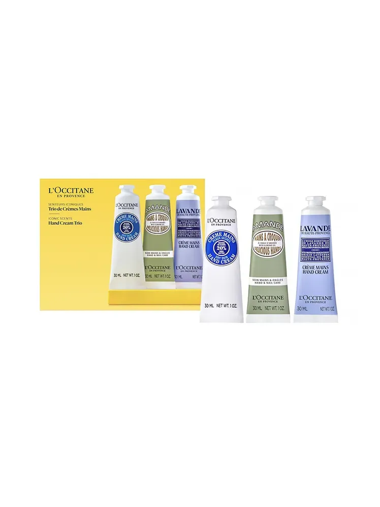 Loccitane Hand Cream Classics dengan kemasan kotak bermerek dengan tiga krim tangan tabung dengan latar belakang putih