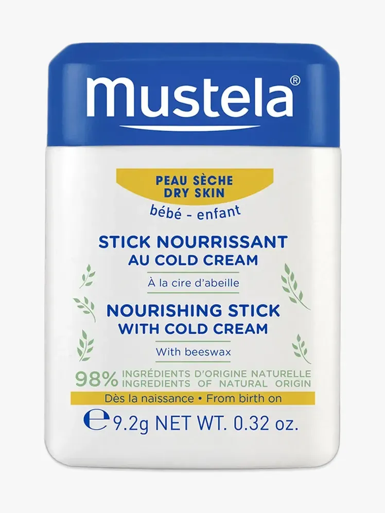 Mustela Baby Nutriente Stick in componente di marca su uno sfondo grigio chiaro