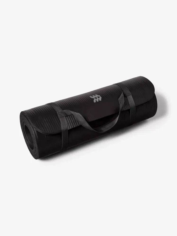 เสื่อออกกำลังกาย All in Motion Premium ส่วนประกอบที่มีตราสินค้าบนพื้นหลังสีเทาอ่อน