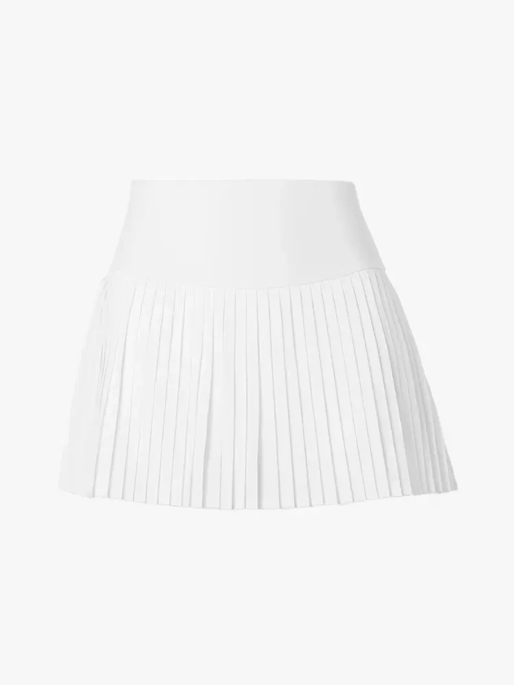 Тенісна спідниця Alo Grand Slam у фірмовому складі на світло-сірому фоні