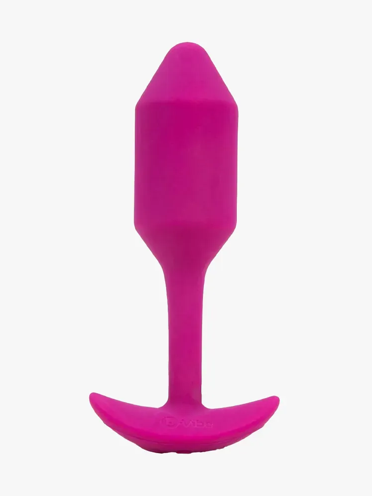 Фірмовий компонент B-Vibe Vibrating Snug Plug на світло-сірому фоні