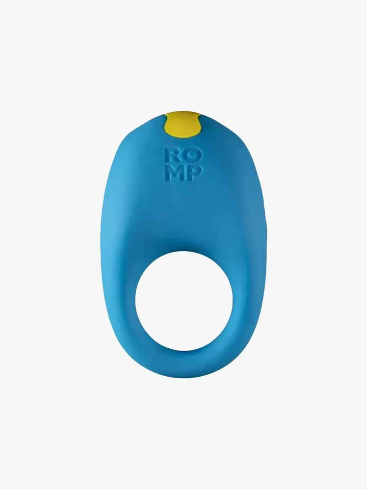 Romp Juke Vibrating Penis Ring в фірмовому комплекті на світло-сірому фоні