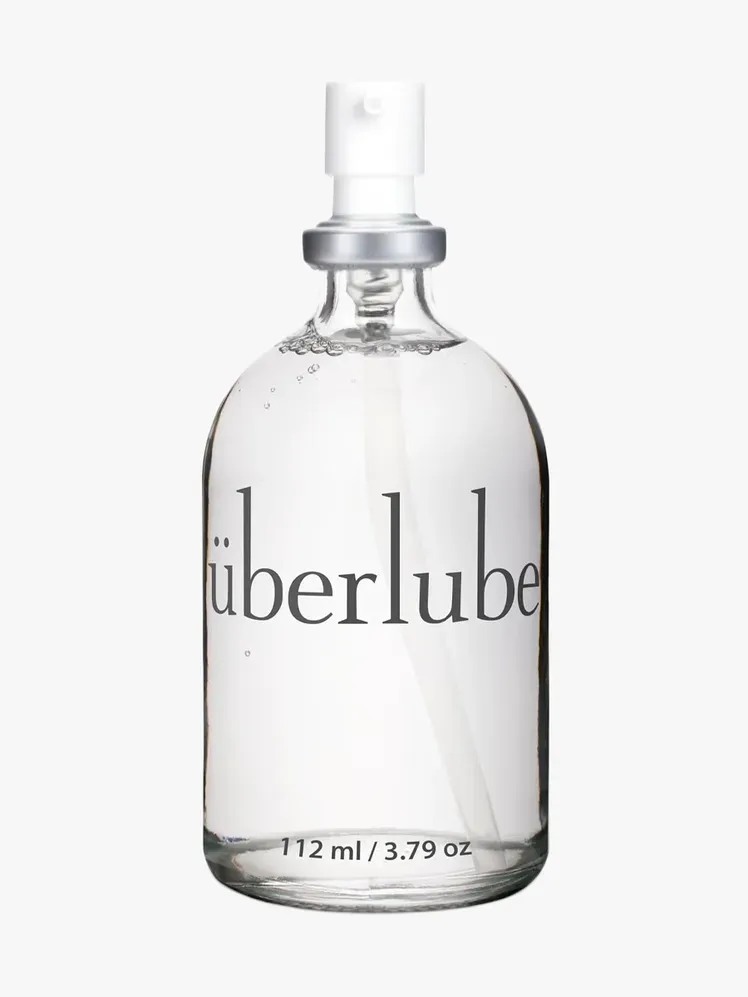 Uberlube Luxury Lubricant у фірмовому компоненті на світло-сірому фоні
