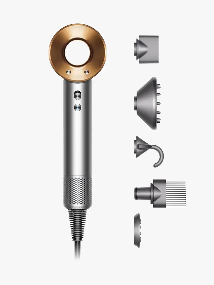 Надзвуковий фен Dyson у фірмових компонентах на світло-сірому фоні