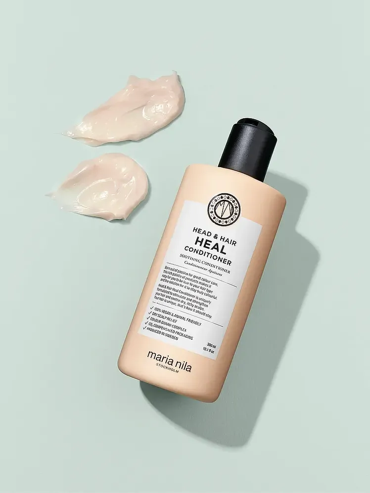 ਬਰਾਂਡੇਡ ਪੀਲੀ ਬੋਤਲ ਵਿੱਚ ਕੰਡੀਸ਼ਨਰ ਨੂੰ ਕਾਲੀ ਕੈਪ ਦੇ ਨਾਲ ਸਚੈਚਾਂ ਦੇ ਨਾਲ ਠੀਕ ਕਰੋ