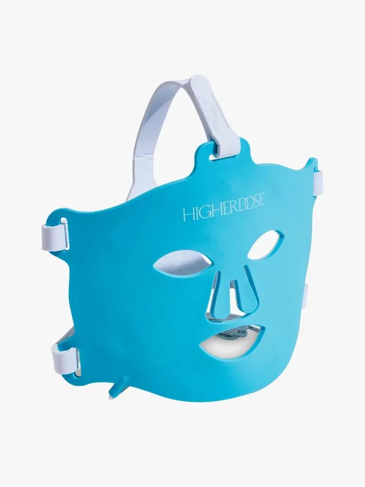 HigherDose Red Light Face Mask i merkekomponent på en lysegrå bakgrunn